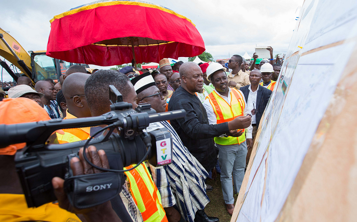 President Mahama being taken through diagrams of the project President Mahama being taken through diagrams of the project